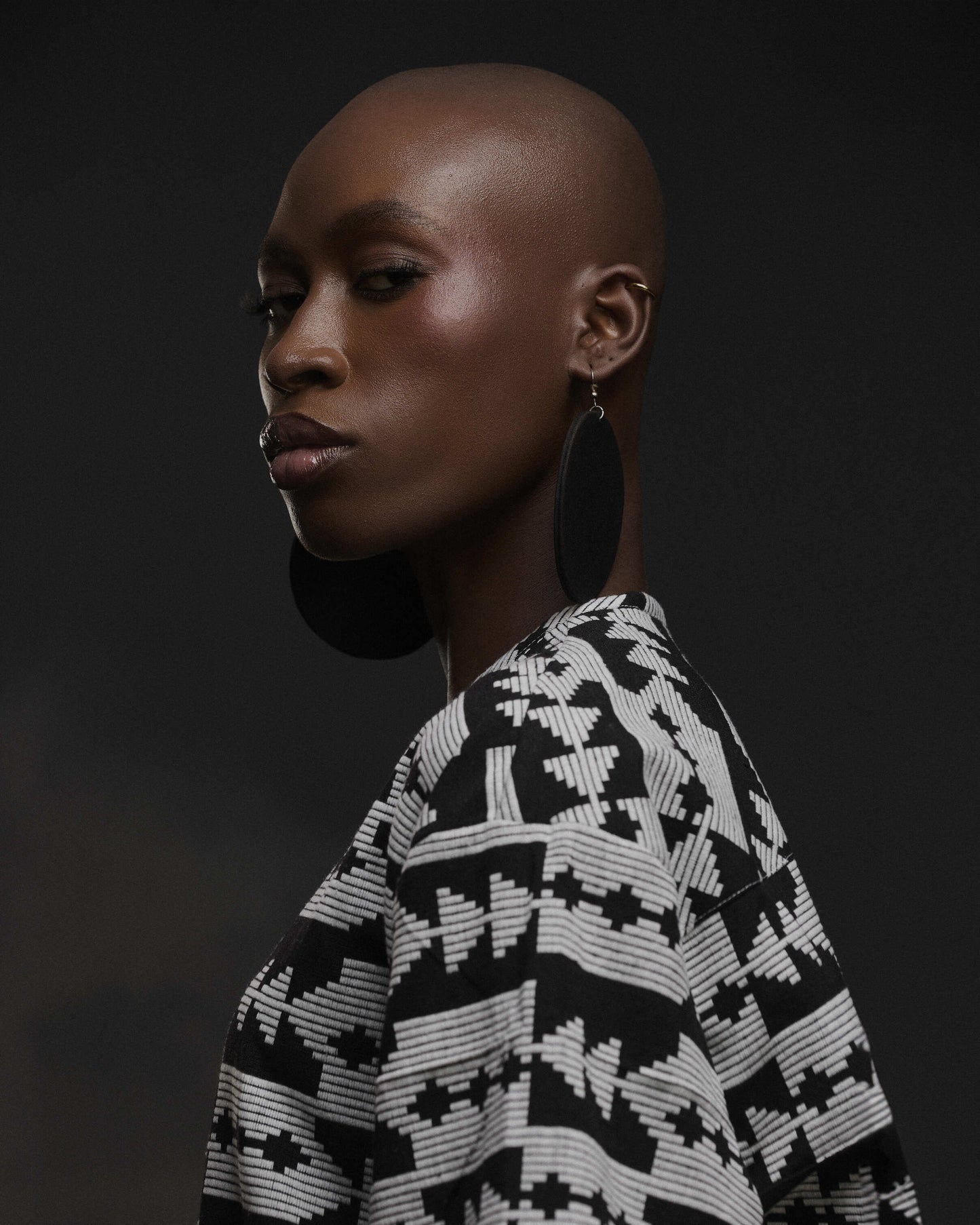 close up view of olah statement set with black earrings